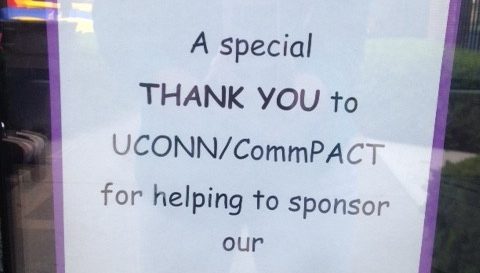 Note in a window reading "A Special Thank You to UCONN/CommPACT for helping to sponsor our Multicultural Night here at John Barry"
